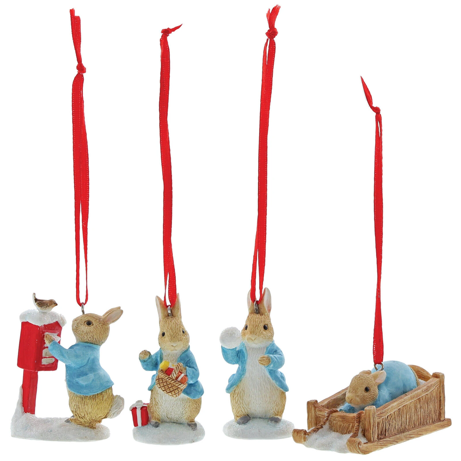 Four Peter Rabbit winter hanging ornaments with red ribbons